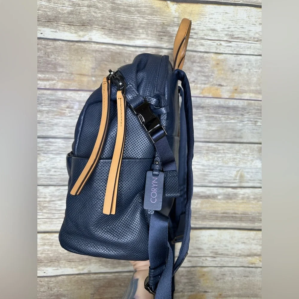 Tumi Navy Perforated Leather Backpack with Tan Handles